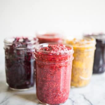 side view of mason jars with different colored chia jam