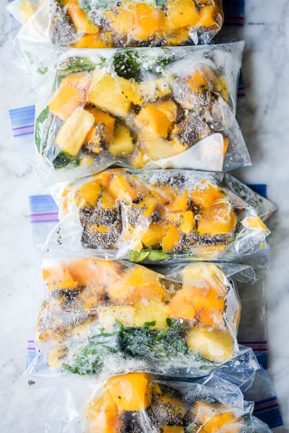 tropical green smoothie packs ready to go into the freezer