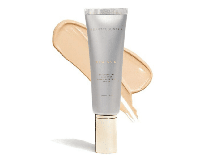 beautycounter dew skin foundation in silver and gold packaging