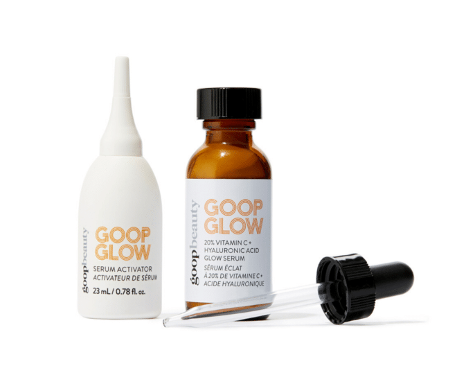 goopglow vitamin c serum in an opaque amber bottle next to a white bottle of serum activator