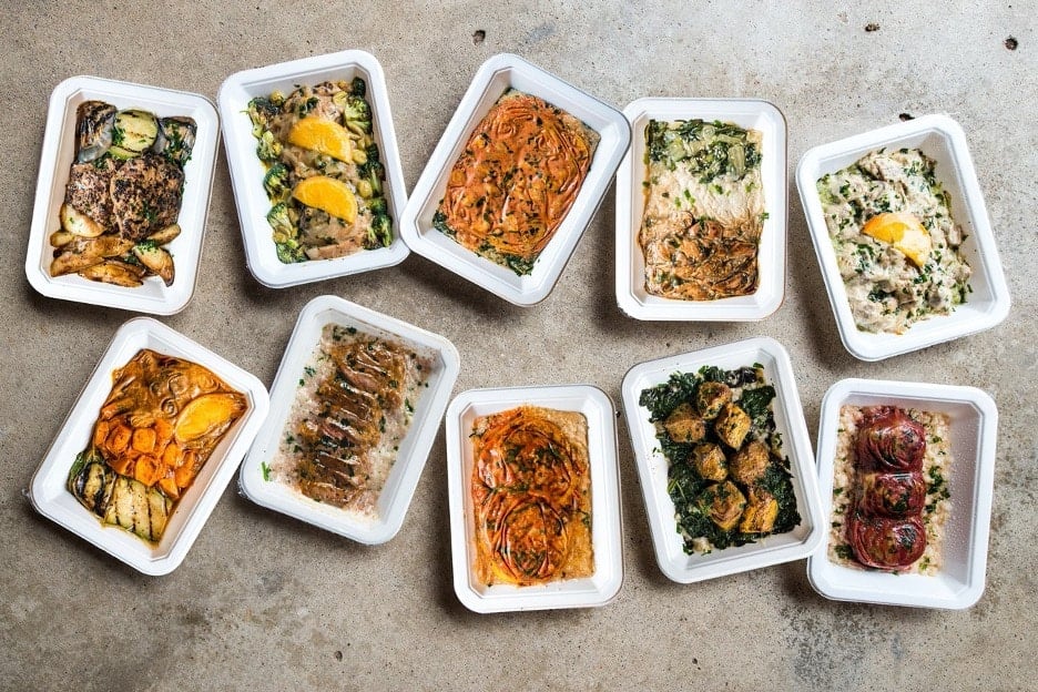 an assortment of balanced bites frozen meals on a concrete surface