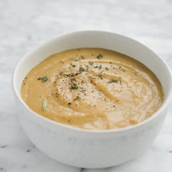 side view of a white bowl of classic gravy