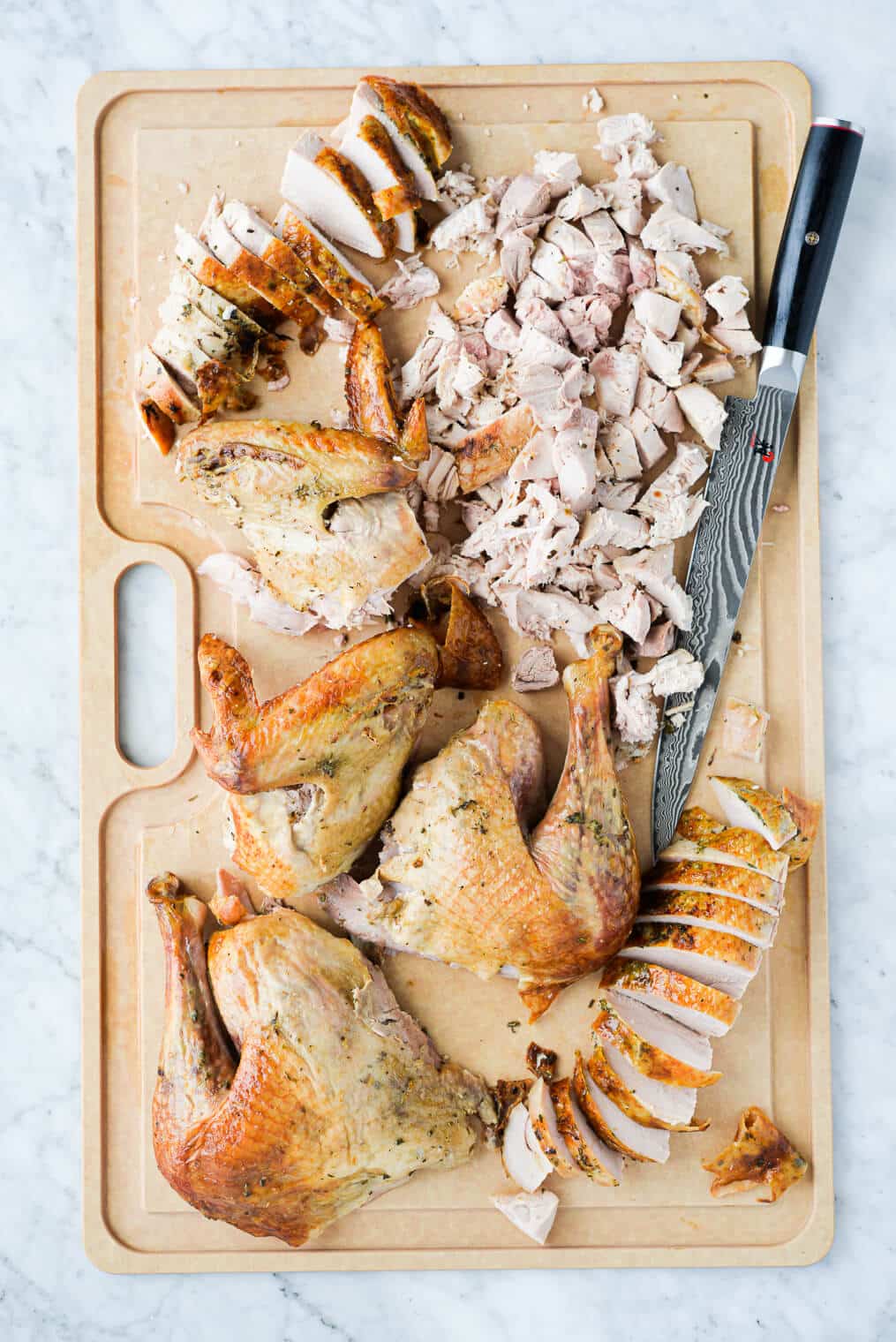 top view of a platter of carved whole roasted turkey