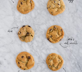 6 cookies lined up in 2 rows on a marble surface to compare different egg substitutes