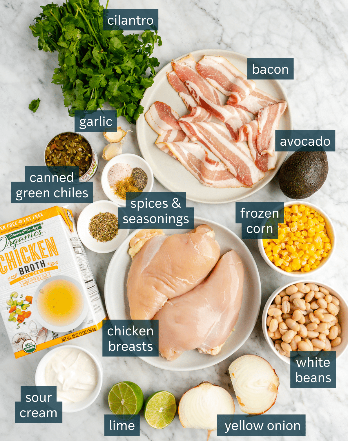 All of the ingredients needed for Instant Pot White Chicken Chili portioned out on plates and in bowls.