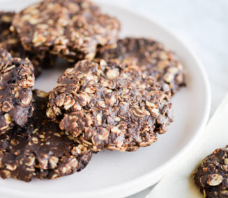a plate of finished no bake oatmeal cookies sitting on a marble surface