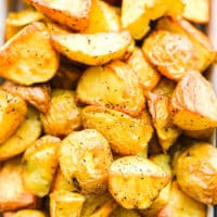 a close up of a small baking dish filled with crispy roasted potatoes