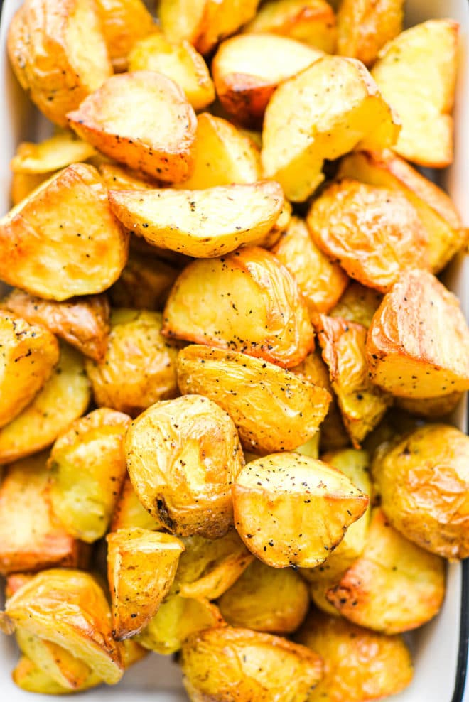 a close up of a small baking dish filled with crispy roasted potatoes