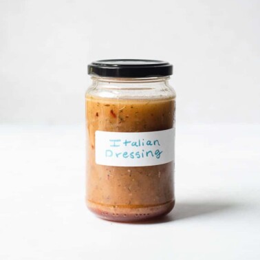 a labeled jar of homemade "Italian dressing" with a black lid on it