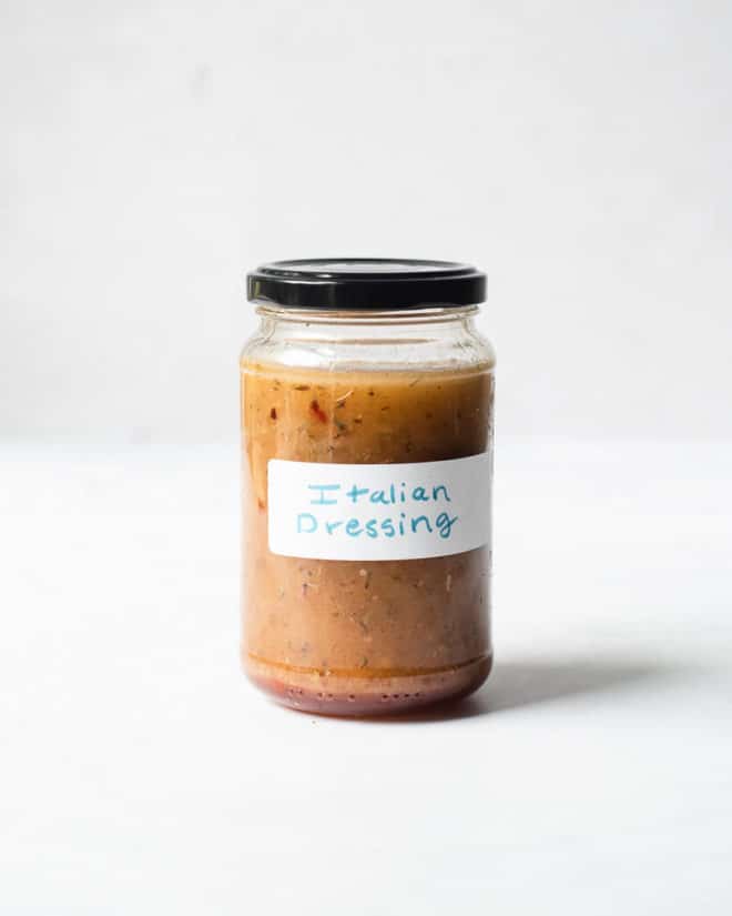 a labeled jar of homemade "Italian dressing" with a black lid on it