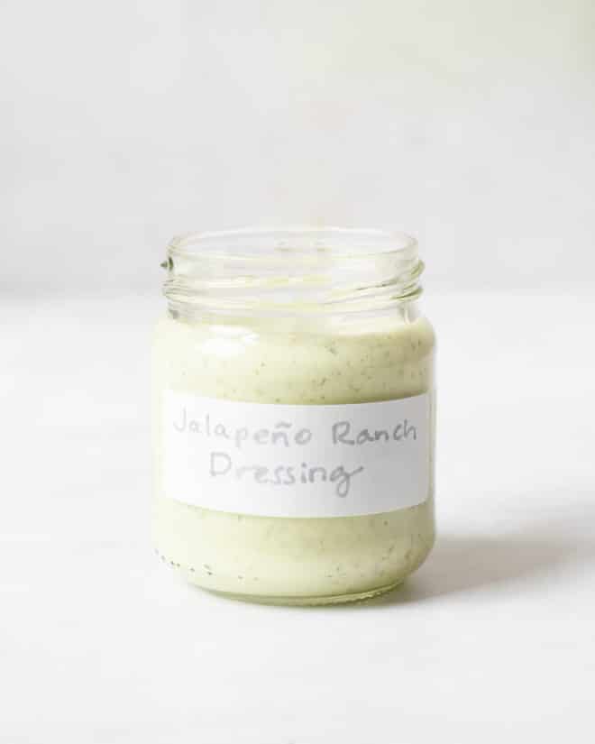 a small labeled jar filled with jalapeno ranch dressing