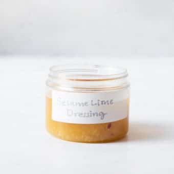 a small labeled jar filled with homemade sesame lime dressing