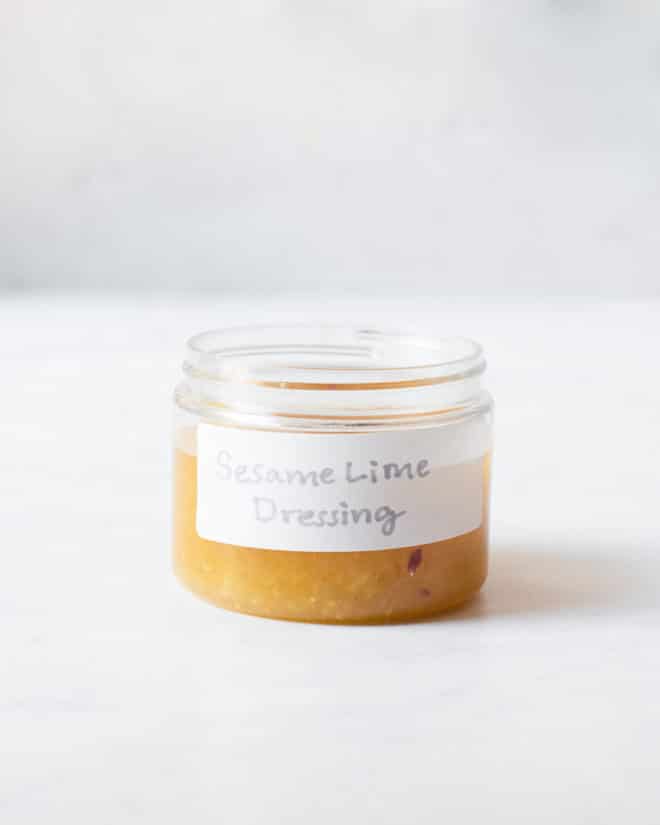 a small labeled jar filled with homemade sesame lime dressing