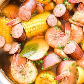 a large pot of shrimp, potatoes, corn, and sausage