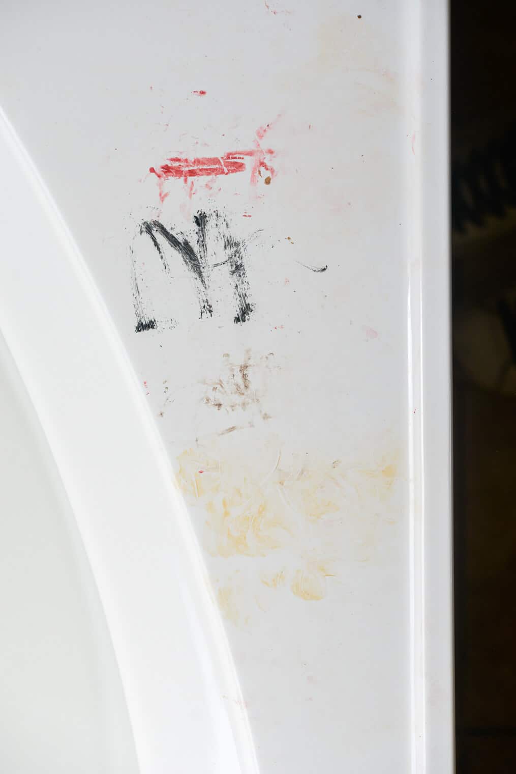a bathroom tub covered on makeup smears