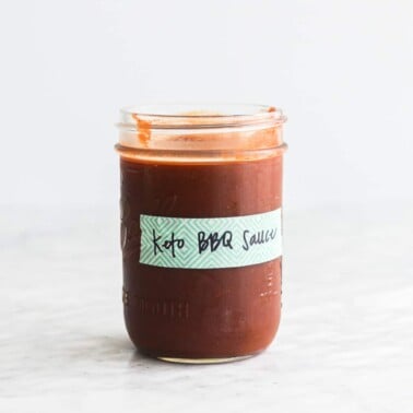a labeled mason jar of keto bbq sauce