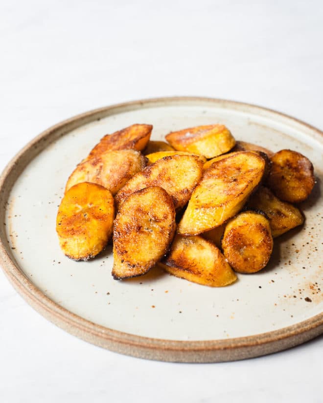 sliced, pan fried plantains on a plate