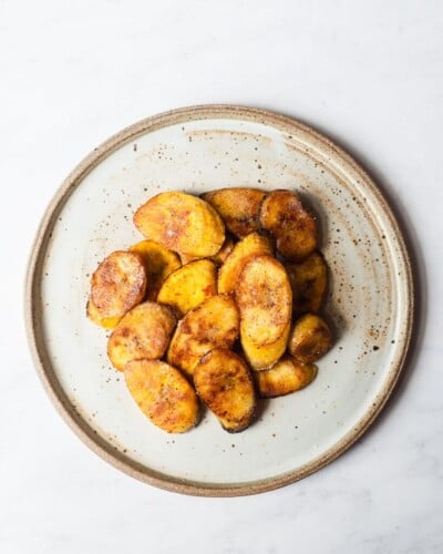 sliced, pan fried plantains on a plate