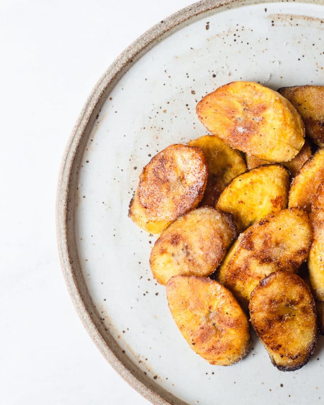 sliced, pan fried plantains on a plate