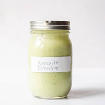 a labeled jar of avocado dressing