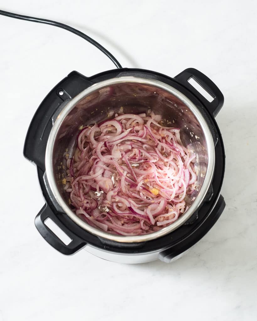 sauteed red onions, garlic, and ginger in a hot instant pot