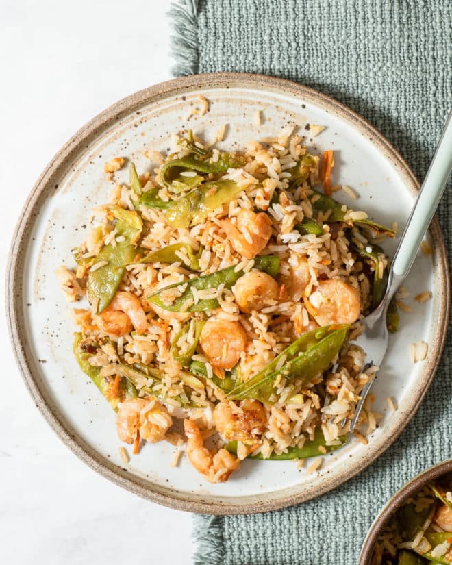 a plate of shrimp fried rice