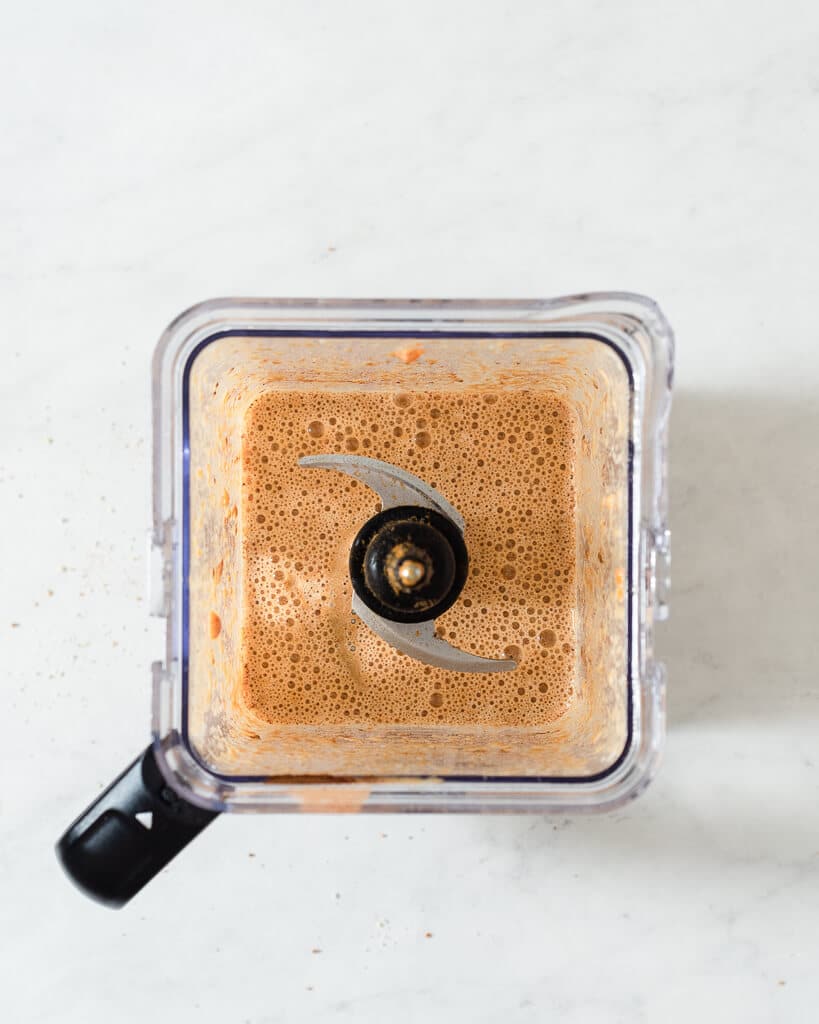 the wet ingredients for keto pumpkin bread in a blender