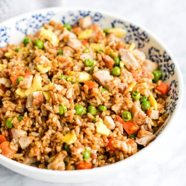 a serving bowl of chicken fried rice