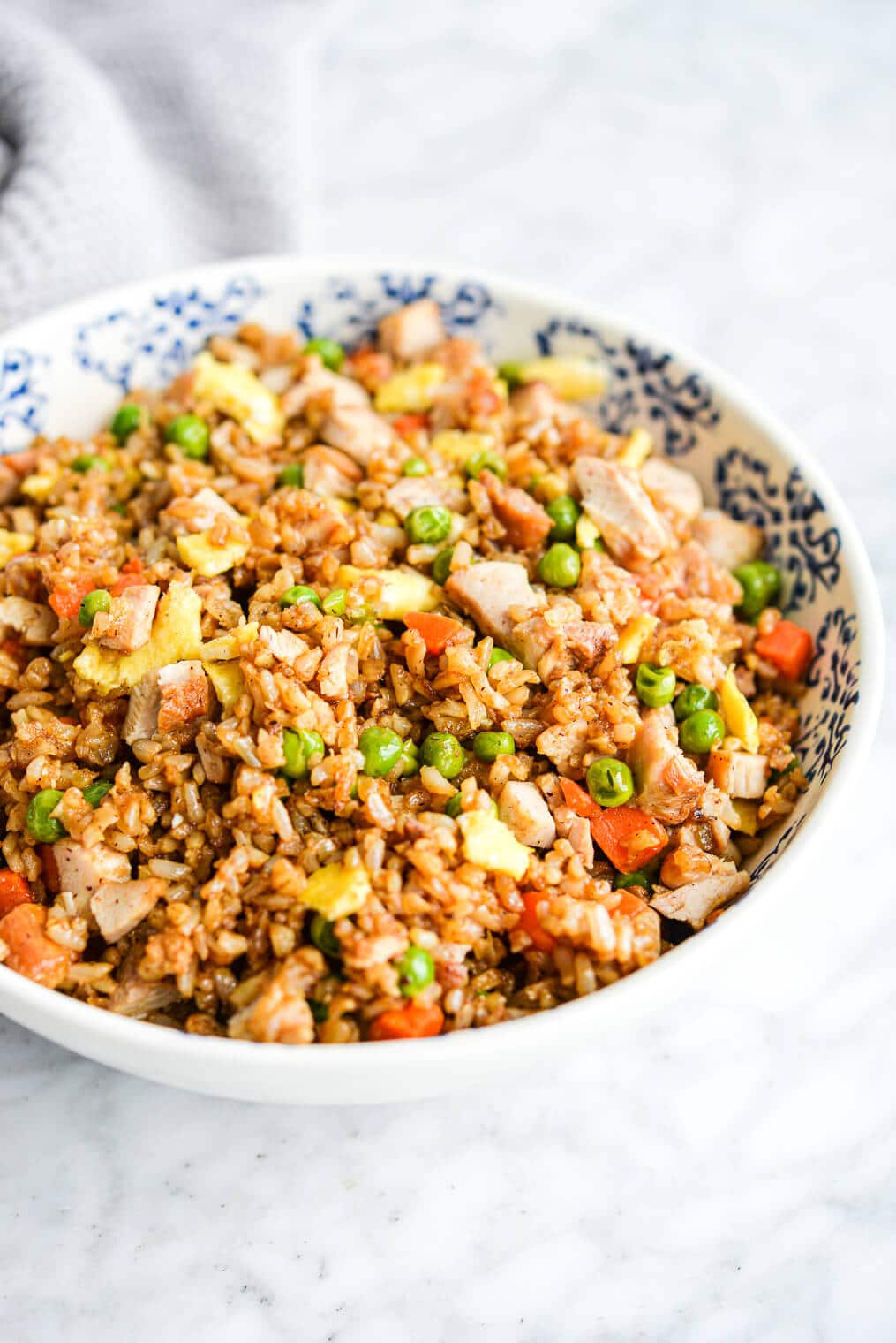 a serving bowl of chicken fried rice