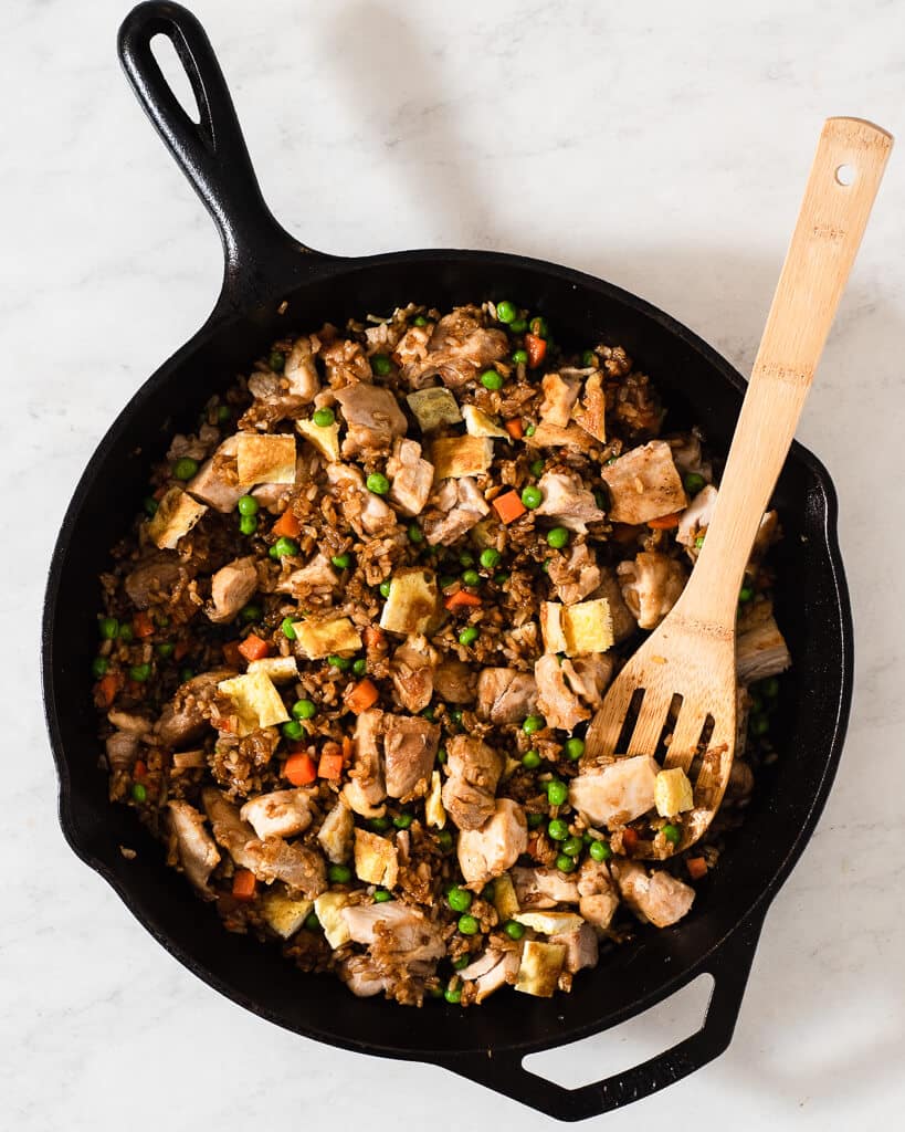 a cast iron skillet of chicken fried rice