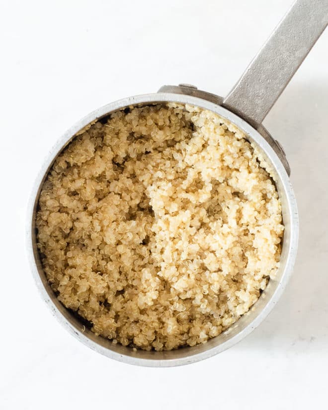 a stainless pot of cooked white quinoa