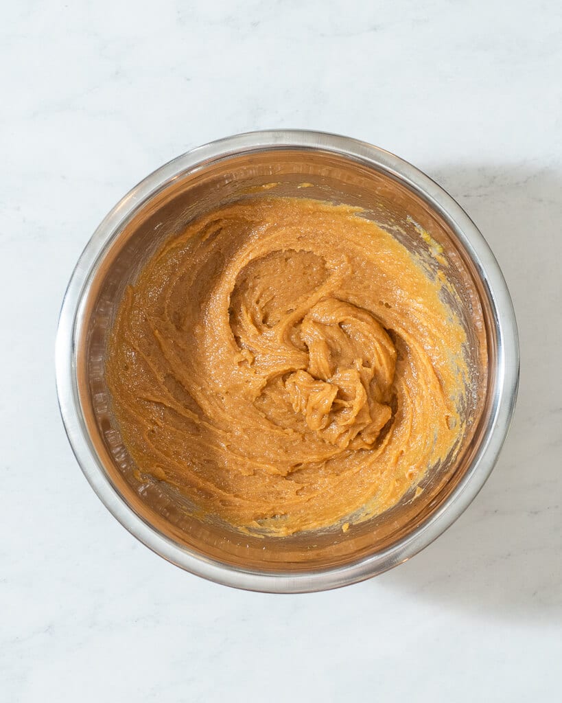 a metal mixing bowl of 3 ingredient peanut butter cookie dough