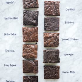 11 different boxed brownies on a marble surface, all clearly labeled