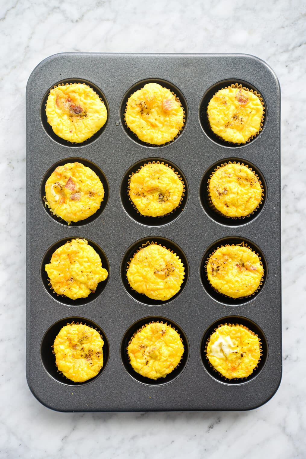 a muffin tin with egg muffins