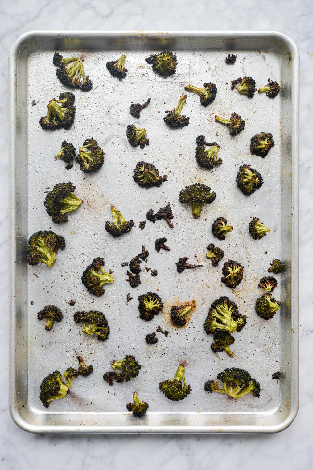 a sheet pan of roasted broccoli florets
