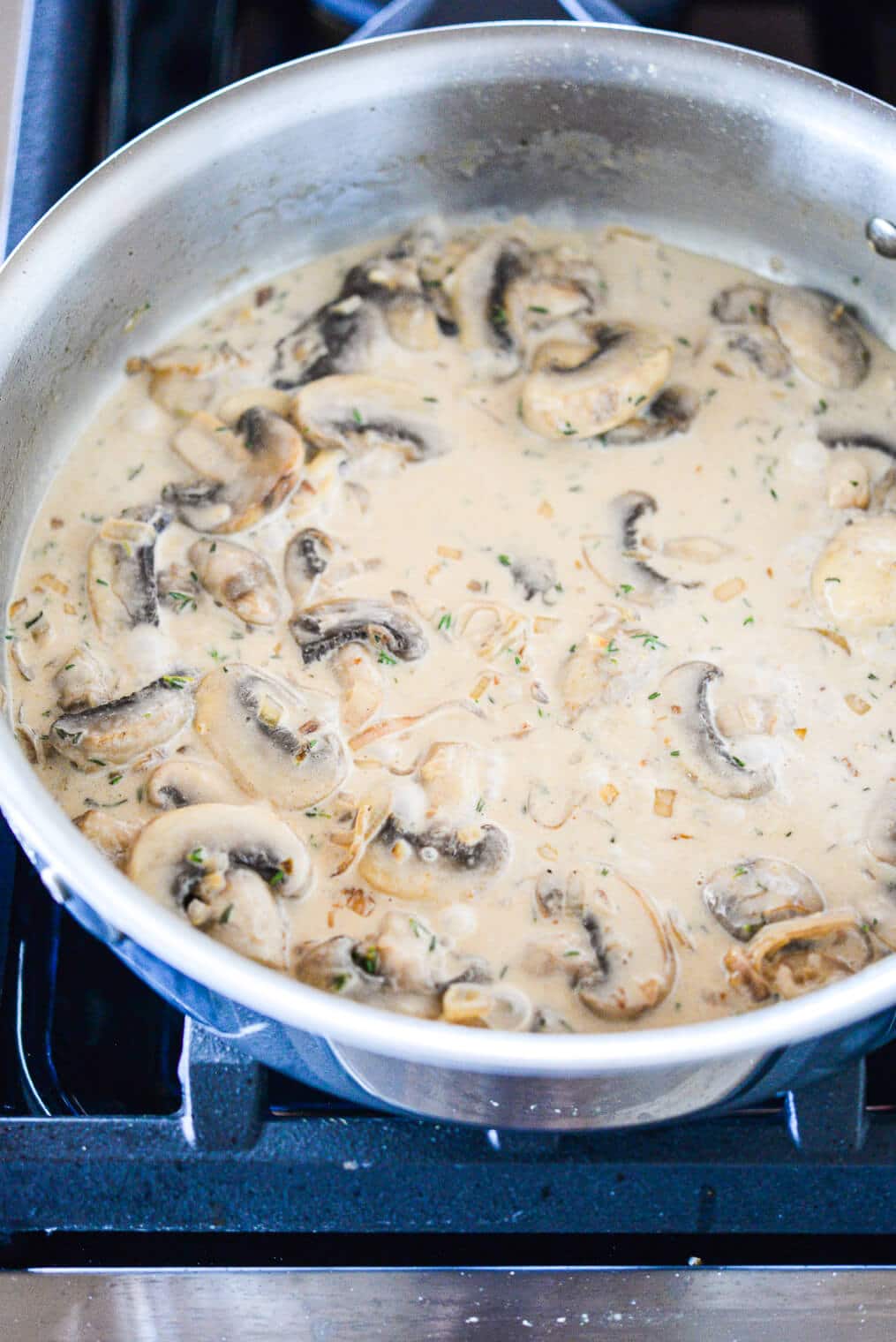 chicken marsala sauce in a skillet on the stovetop
