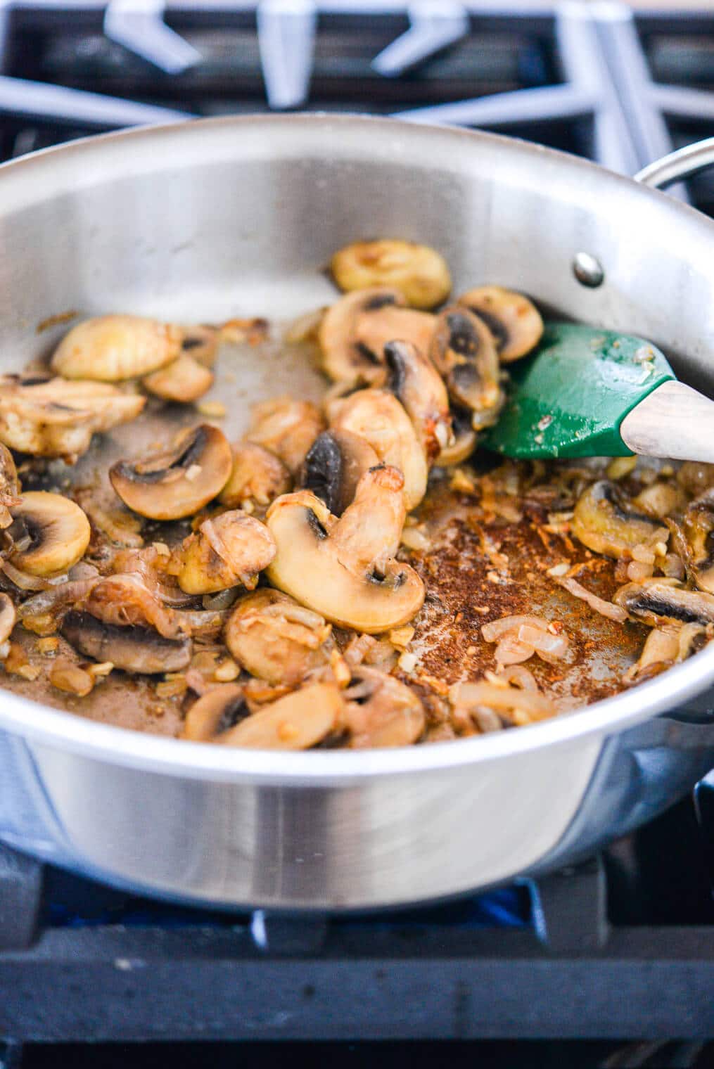 sauteed shallots, garlic, and mushrooms in a skillet