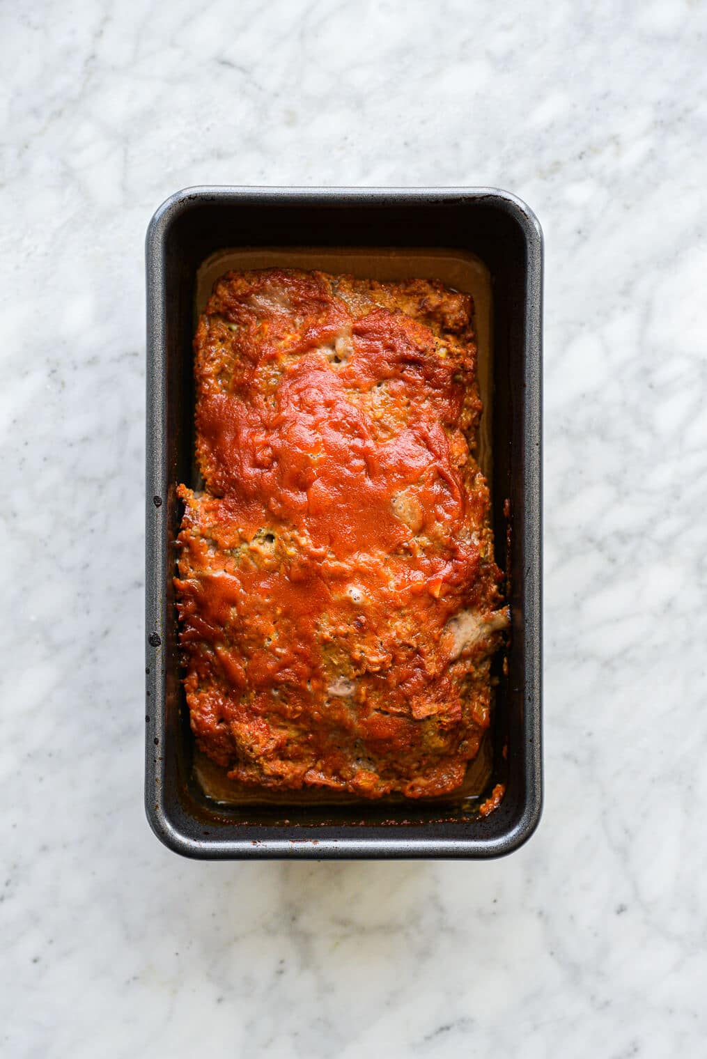 a cooked turkey meatloaf in a loaf pan