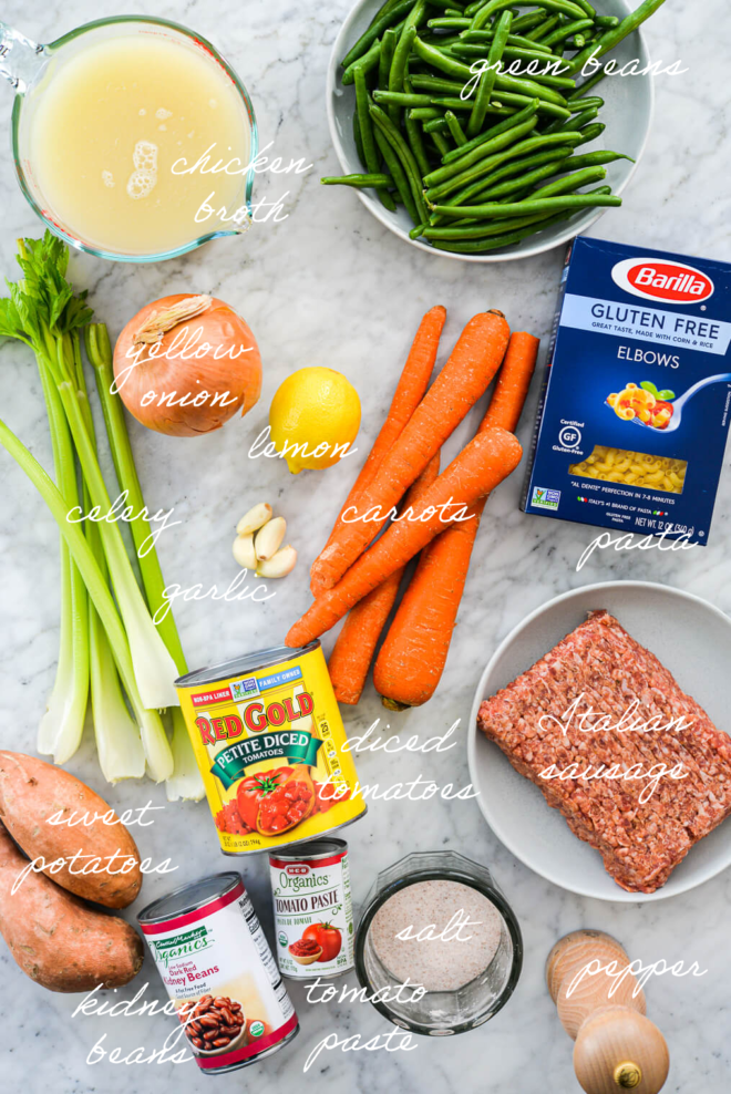 all of the ingredients for minestrone soup on a marble surface