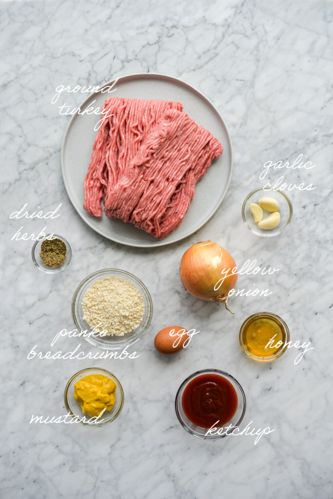all of the ingredients for turkey meatloaf on a marble surface