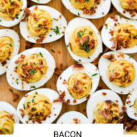 Bacon deviled eggs on a wooden surface with the words "Bacon Deviled Eggs" written in black underneath and "Fed + Fit" in golden orange.