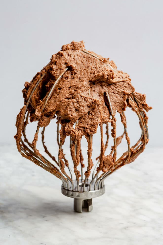 Stand mixer whisk with chocolate buttercream.