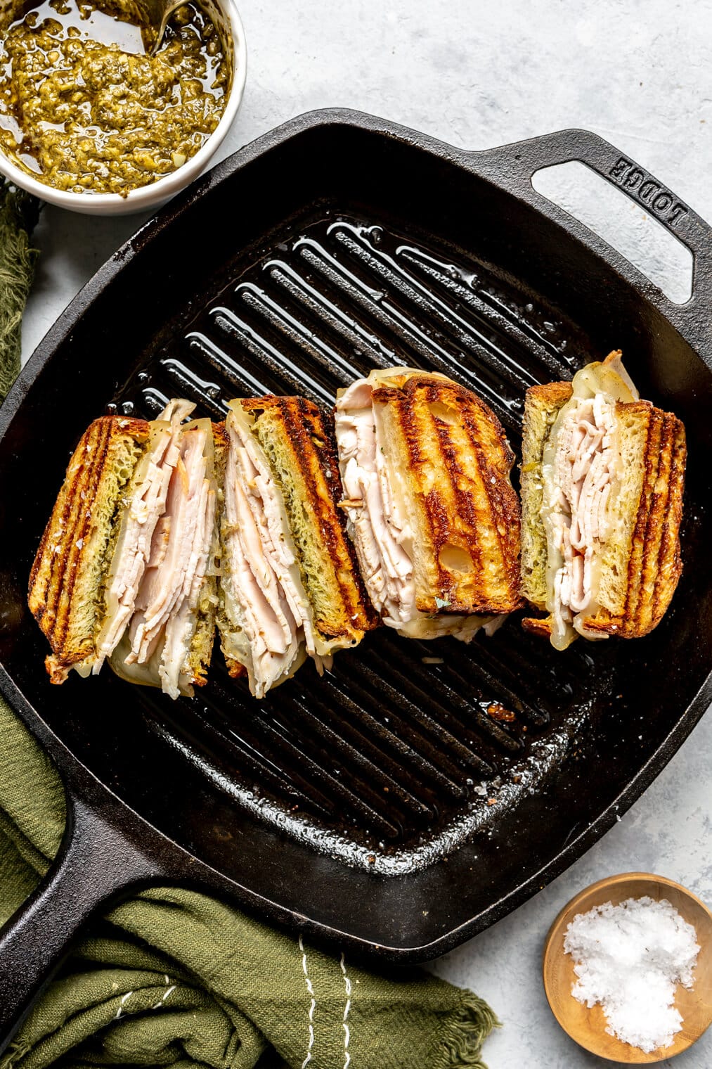Grilled cheese sandwiches in a cast iron grill pan.