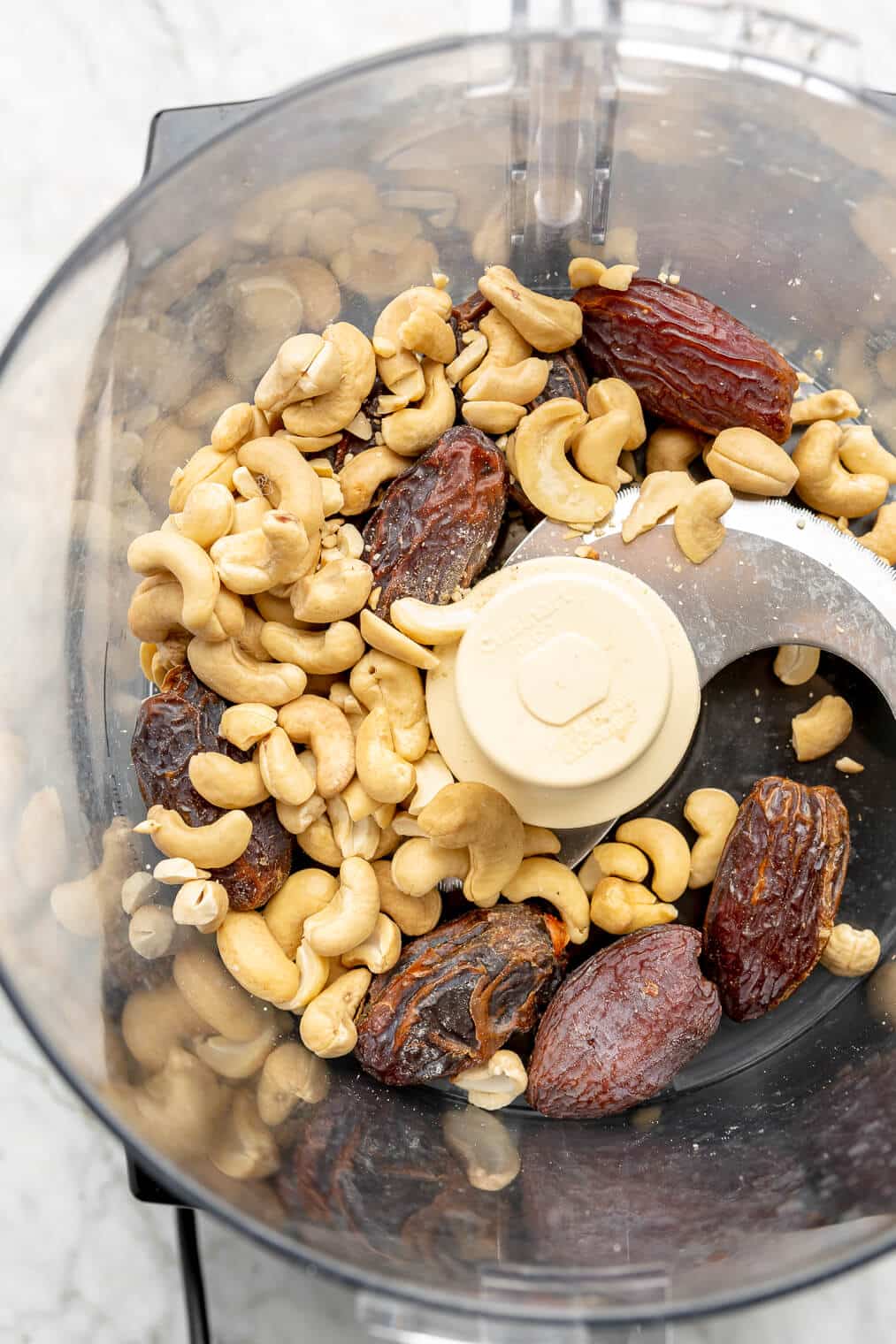 Cashews and dates in a food processor.