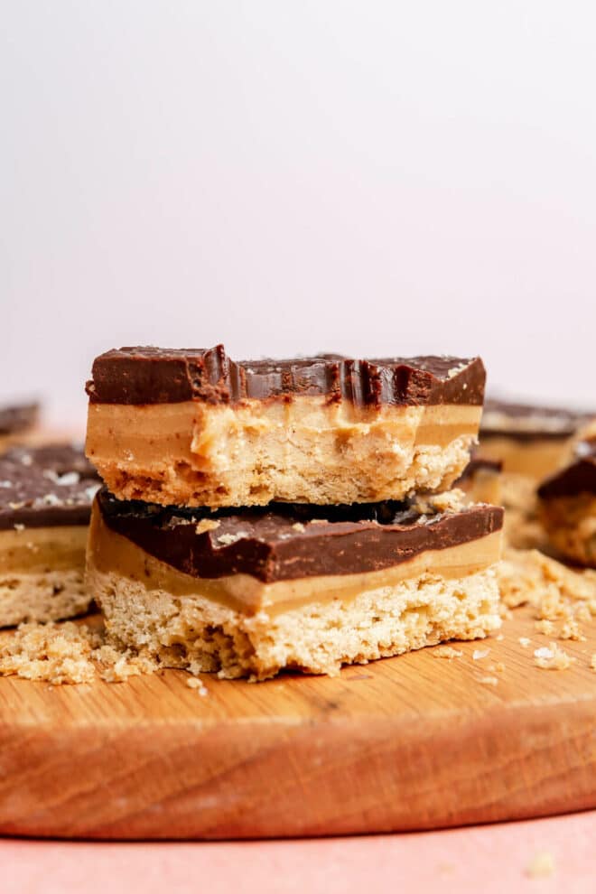 Two millionaire bars stacked on top of one another. The top bar has a bite taken out of it. 