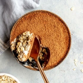 Top down view of a bowl of overnight oats with a spoonful taken out of the top.