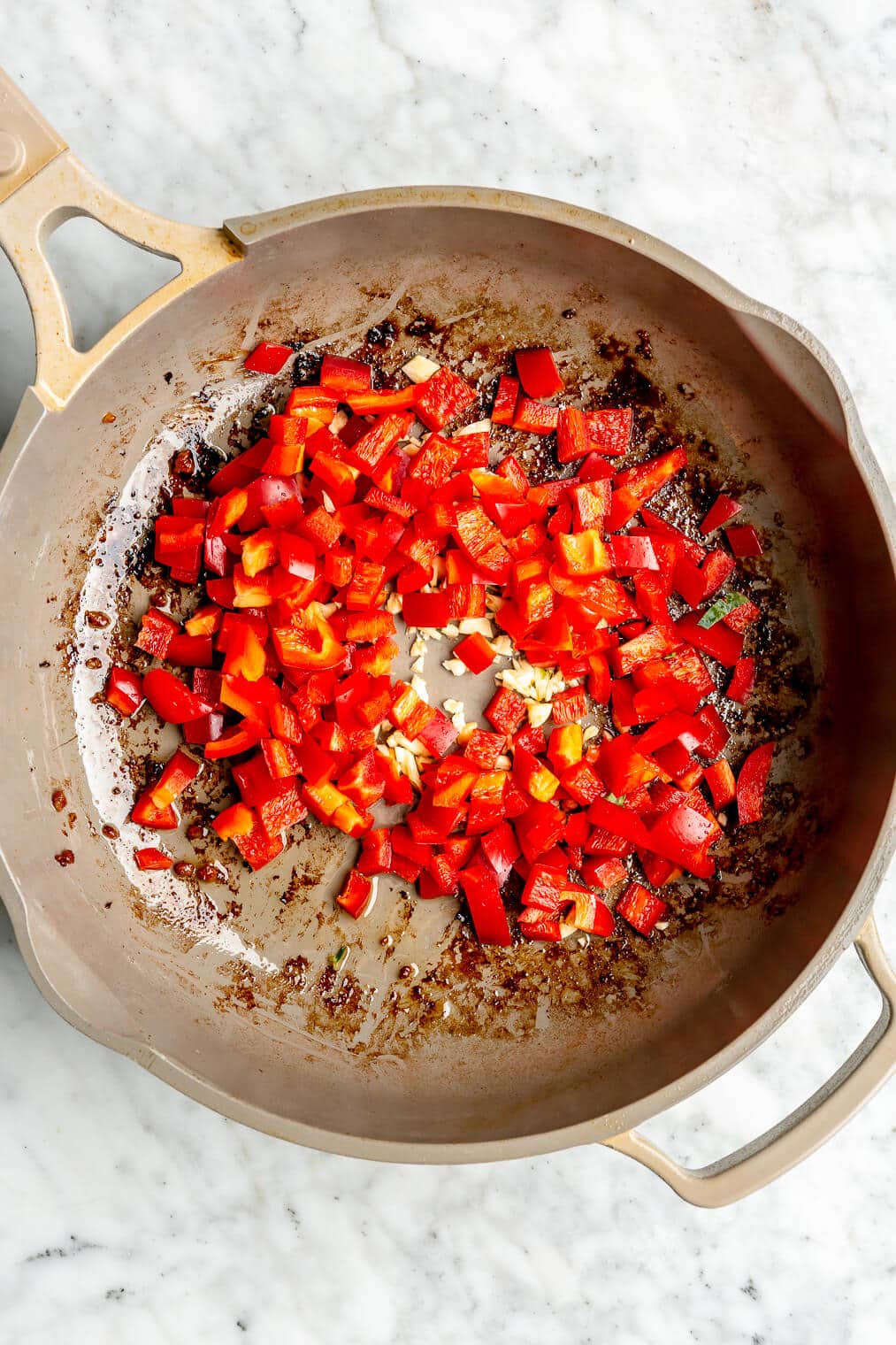 Red pepper and garlic in a pan.