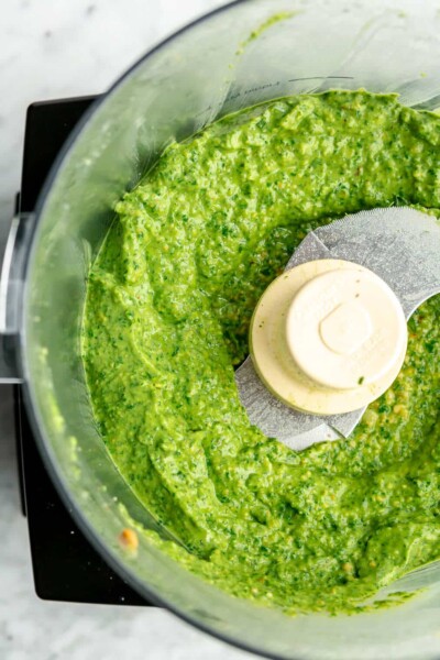 Smooth, creamy, bright green pesto in a food processor.