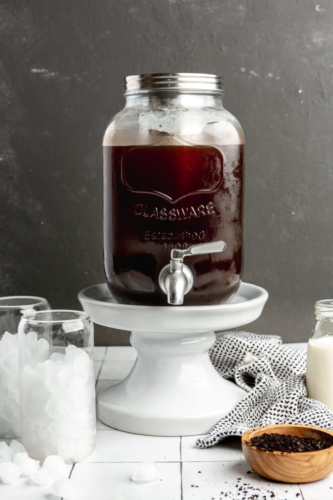 A large glass container of cold brew