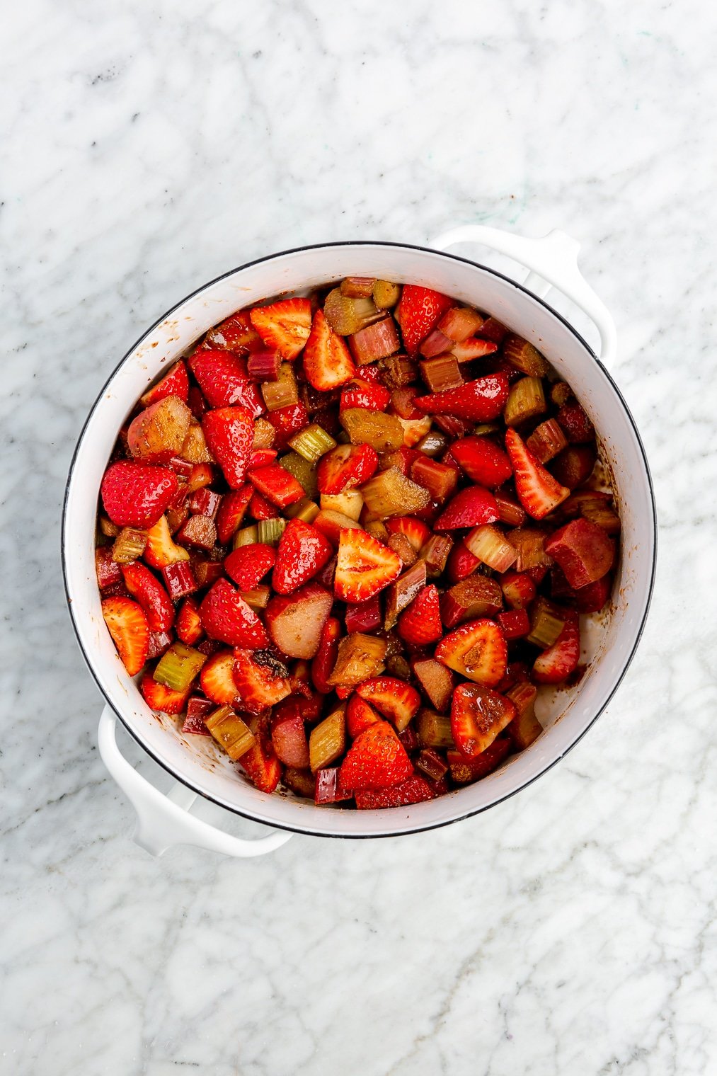 The filling for a strawberry rhubarb crisp in a large dish.